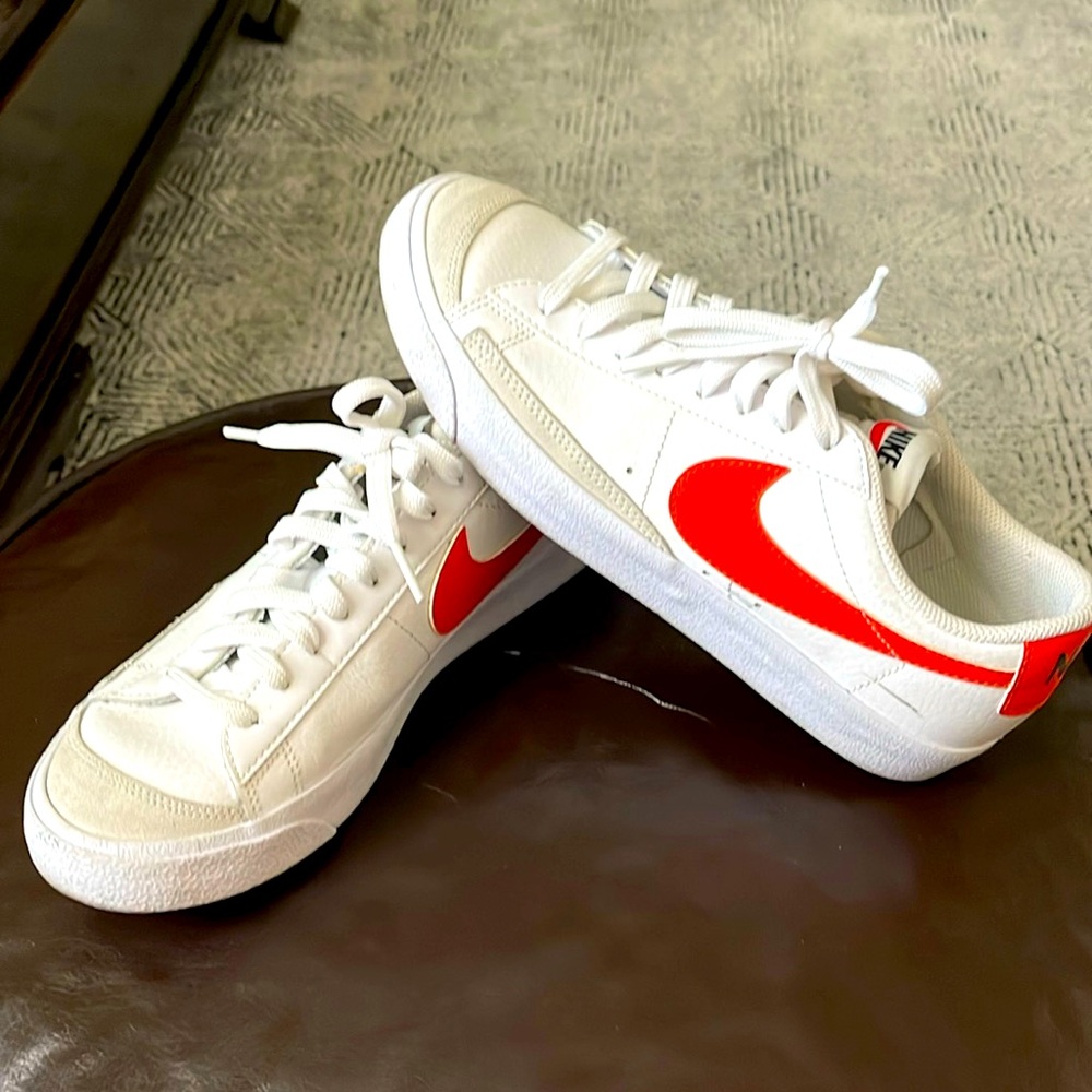 Nike Kids White Sneakers with Bright Red Swoosh Accent